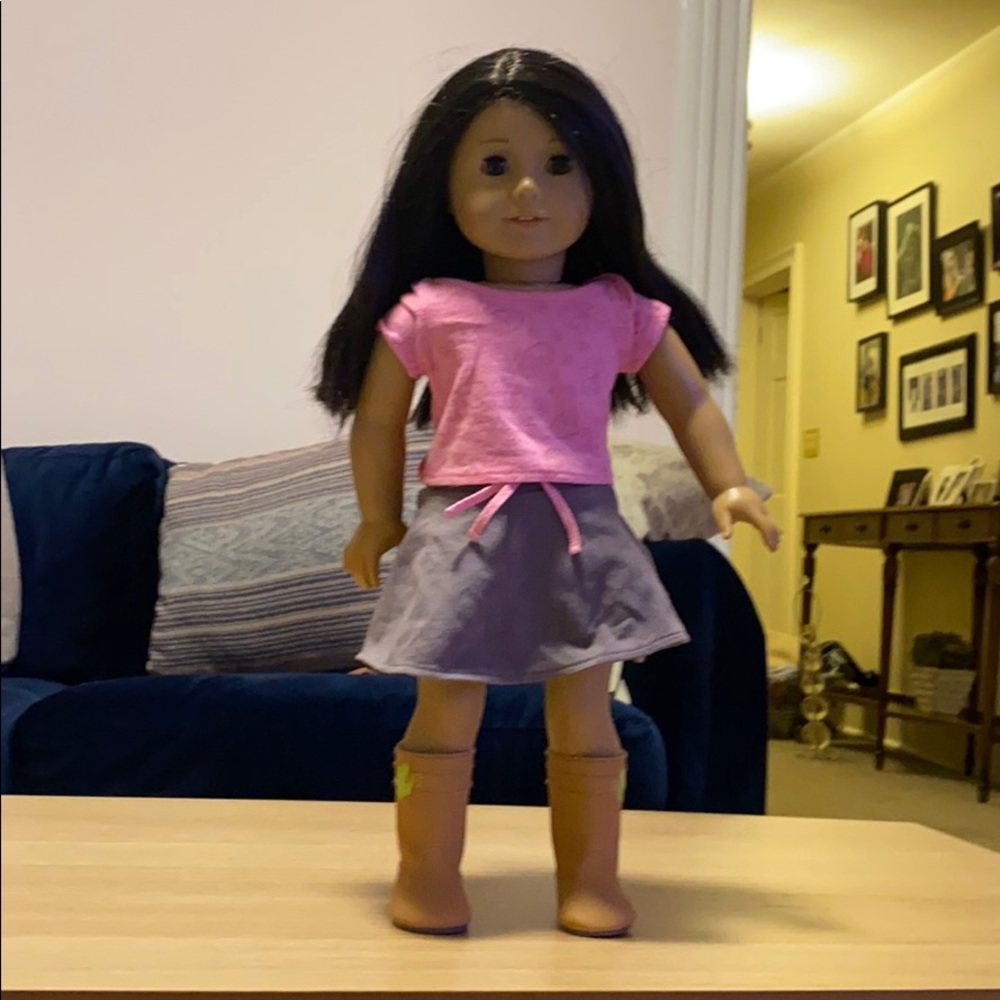 American doll look alike, with clothes